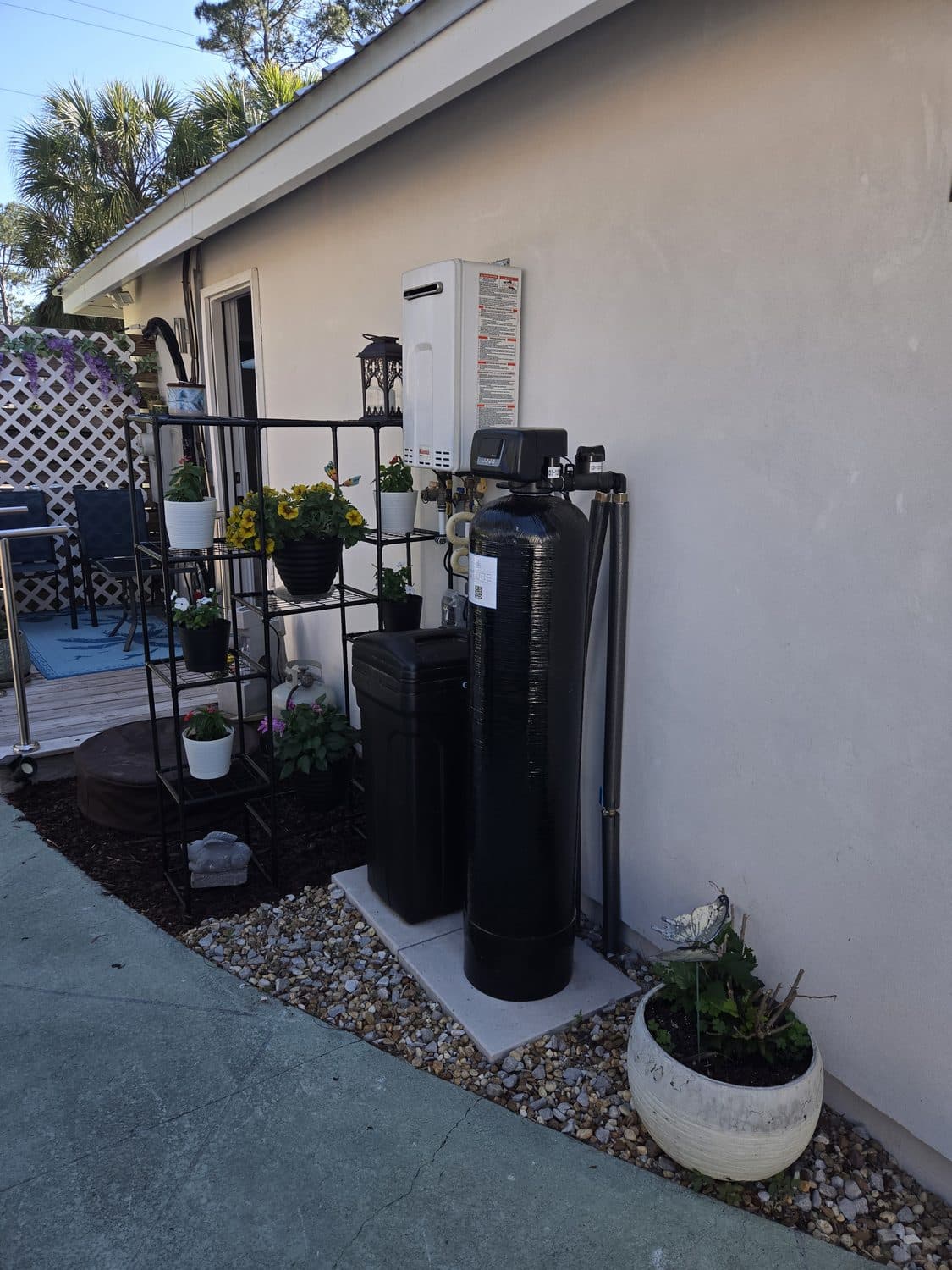 D'Pure whole-home water treatment system installed on a patio